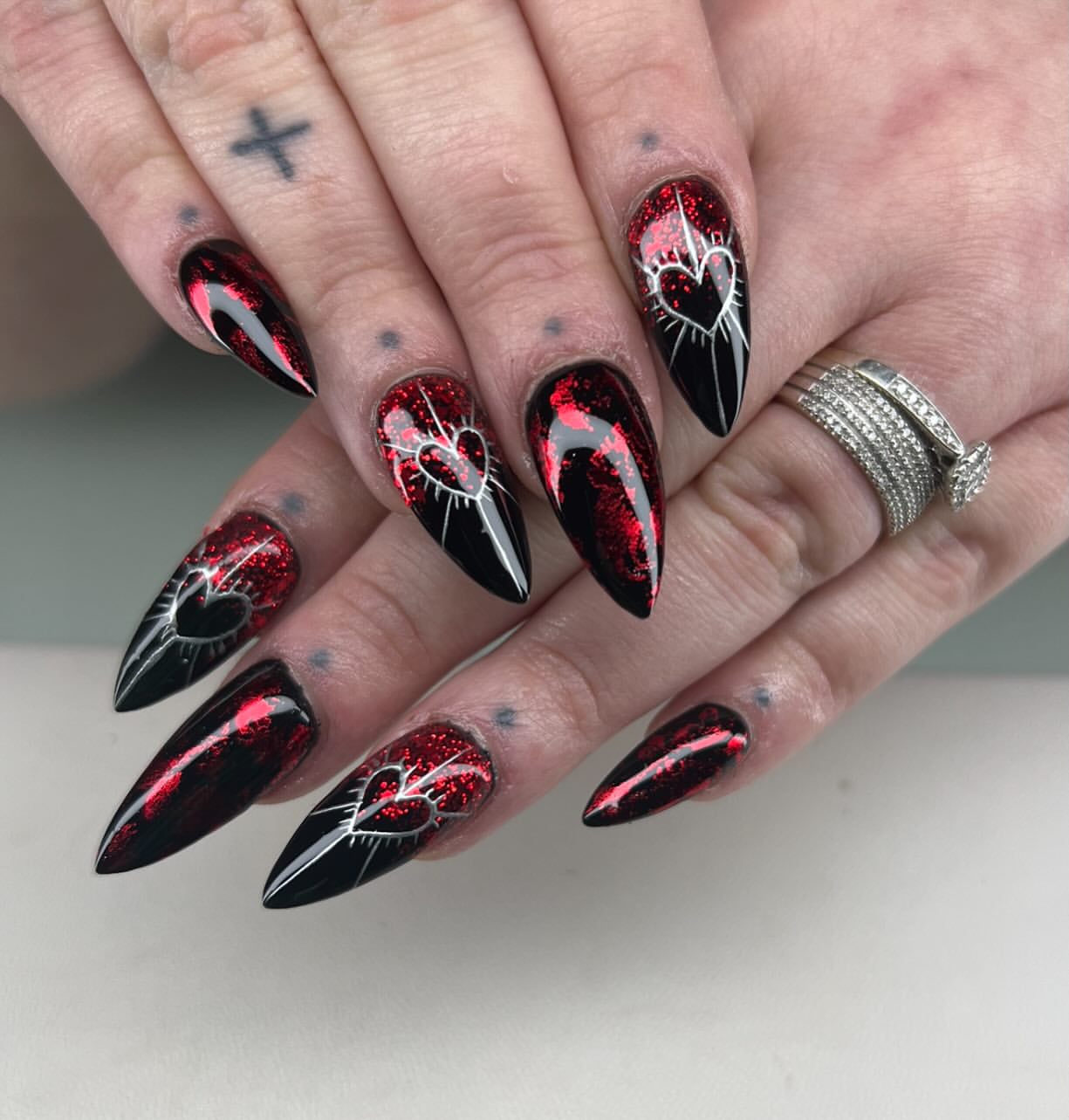 Black and Red Sparkle Heart Stiletto Nails