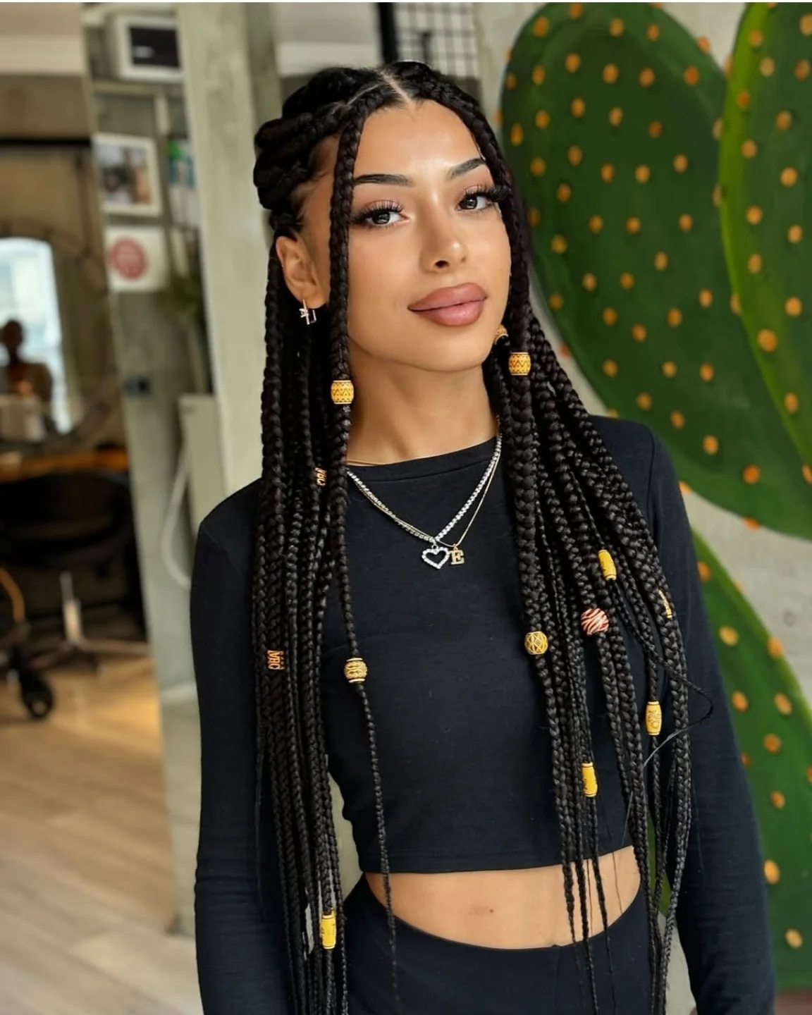 Box Braids With Golden Beads And Face-Framing Tendrils