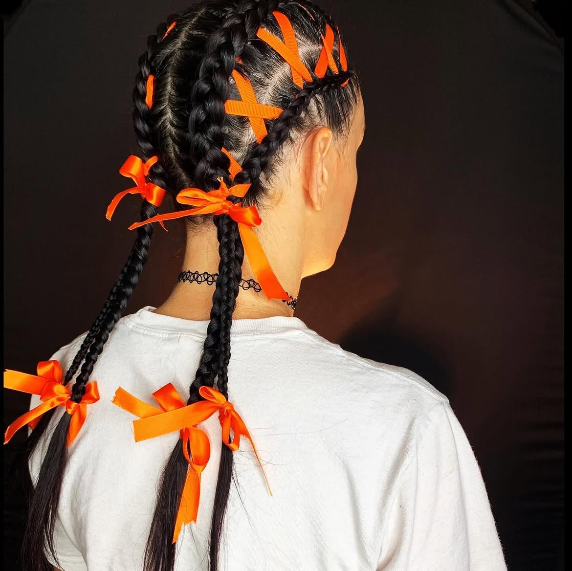 Braided Pigtails With Halloween Orange Ribbons