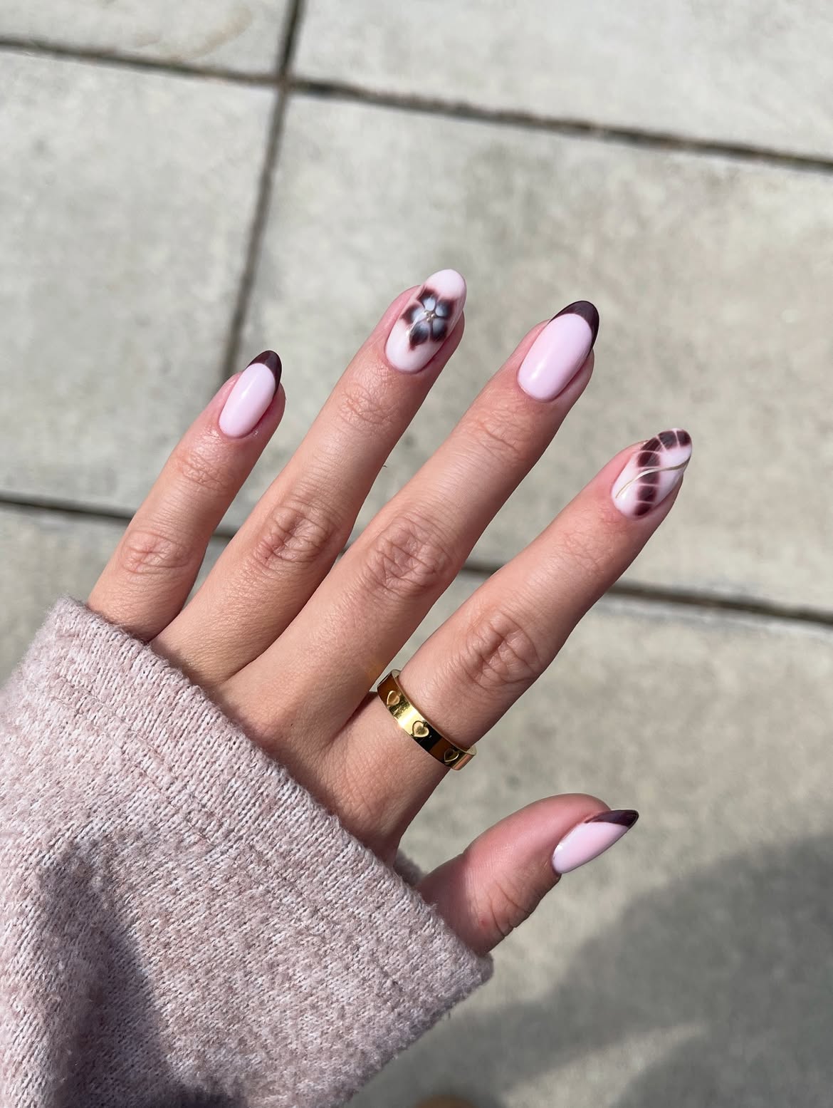 Brown French Tip Almond Nails with Floral Accent