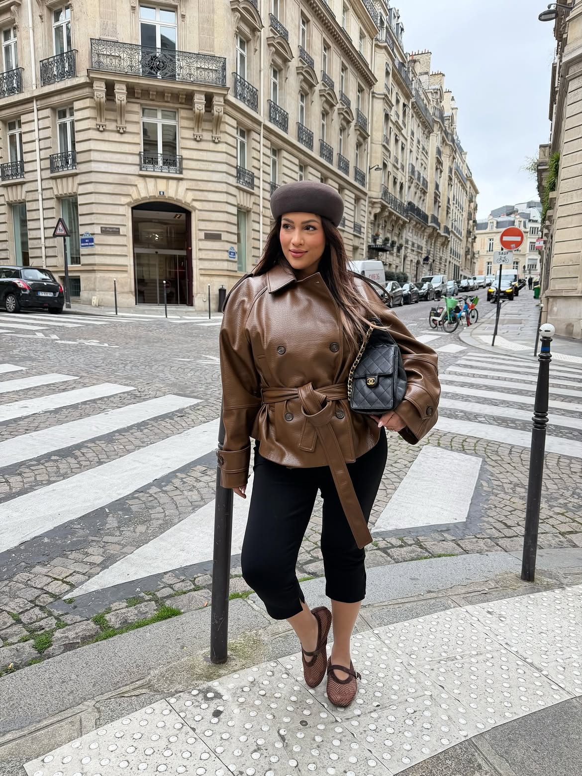 Brown Leather Jacket With Black Capris and Flats