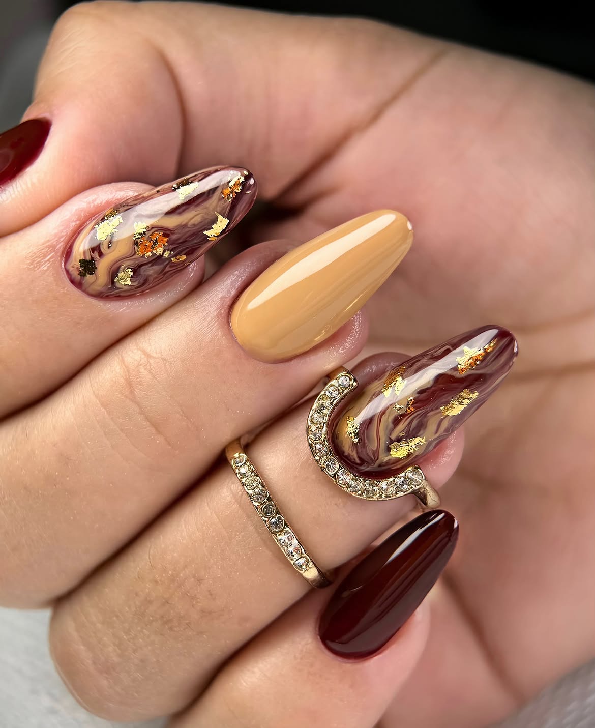Brown Marble Swirl Almond Nails with Gold Foil