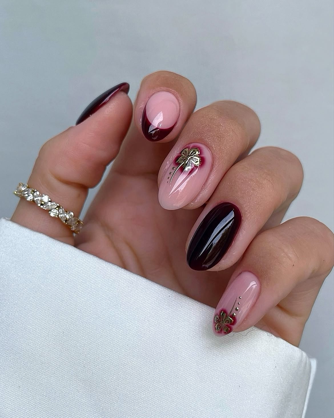 Burgundy French Tips With Gold Flower Accents