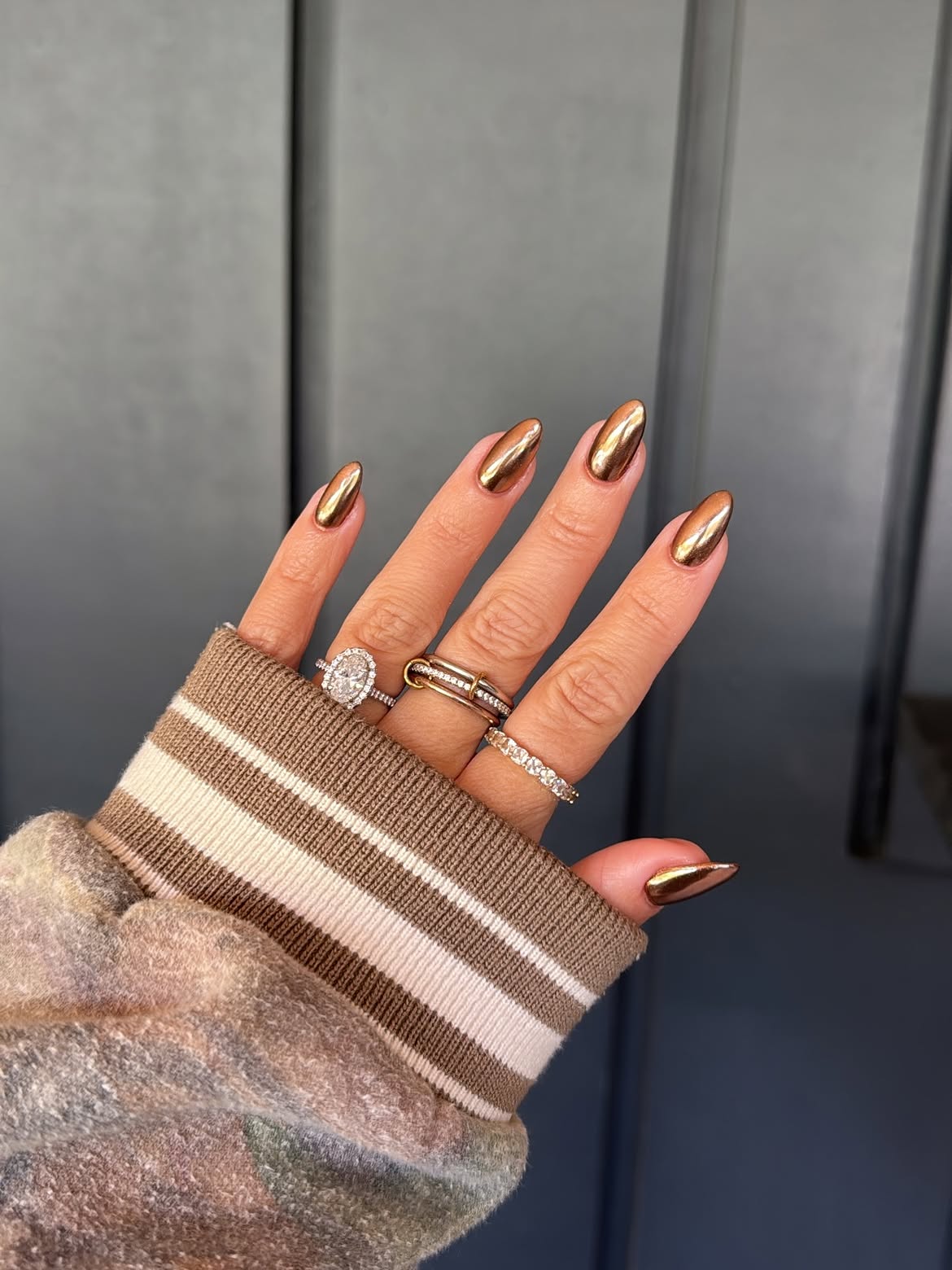 Burnt Orange Chrome Elongated Almond Nails