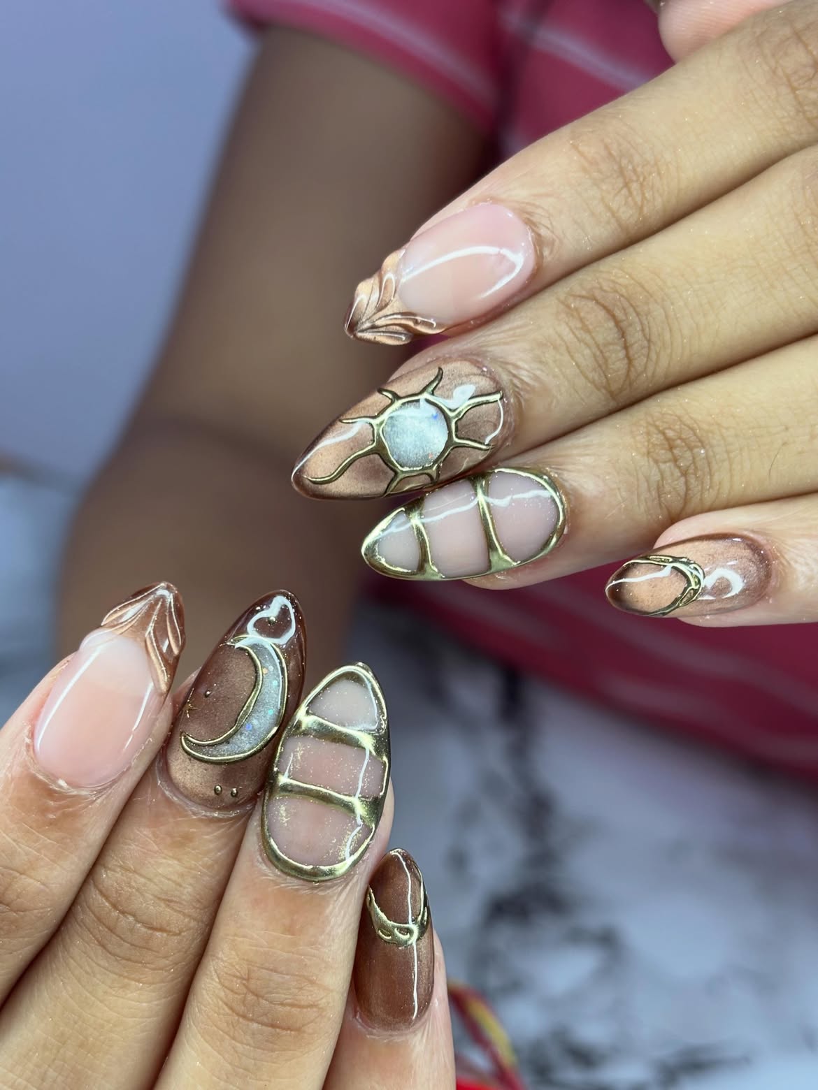 Celestial Aura Almond Nails with Gold Embellishments