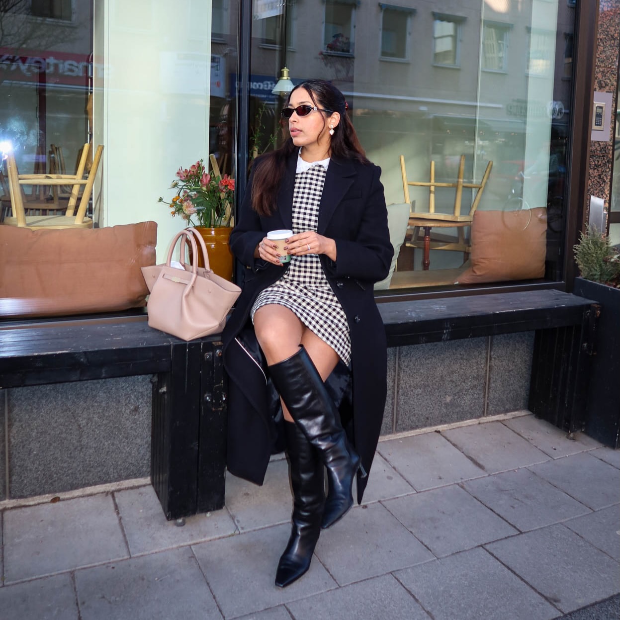 Chic Gingham Dress With Knee-High Boots And Black Coat