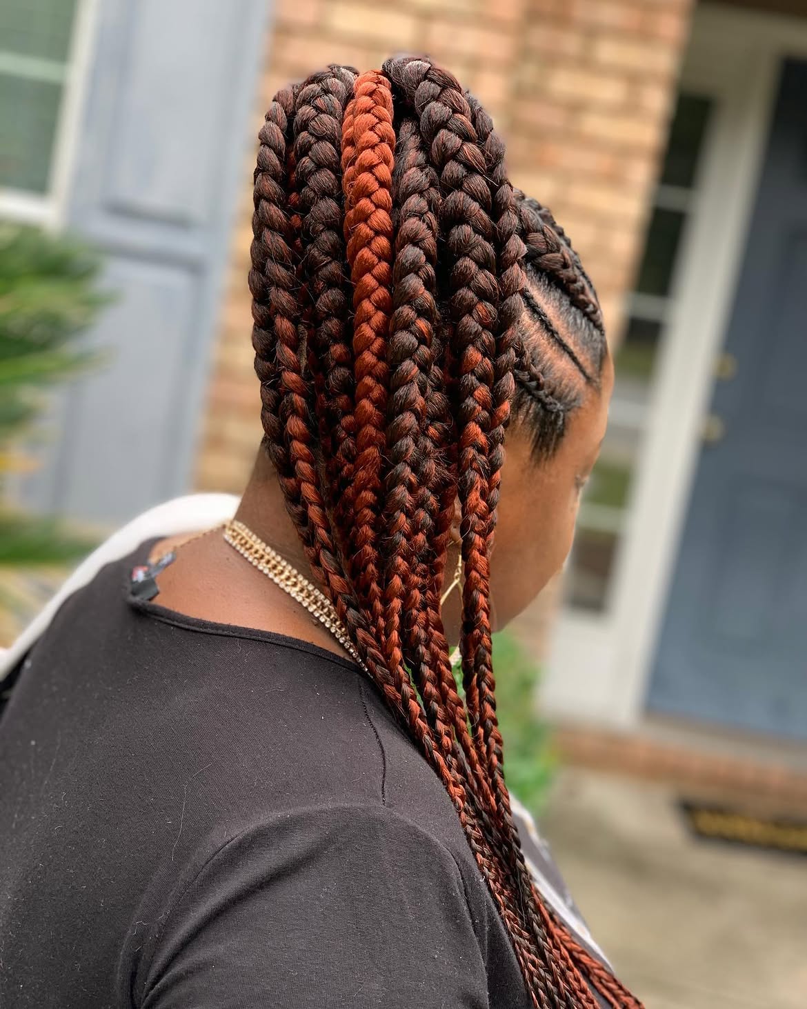Chunky Braids With Copper Highlights In Ponytail