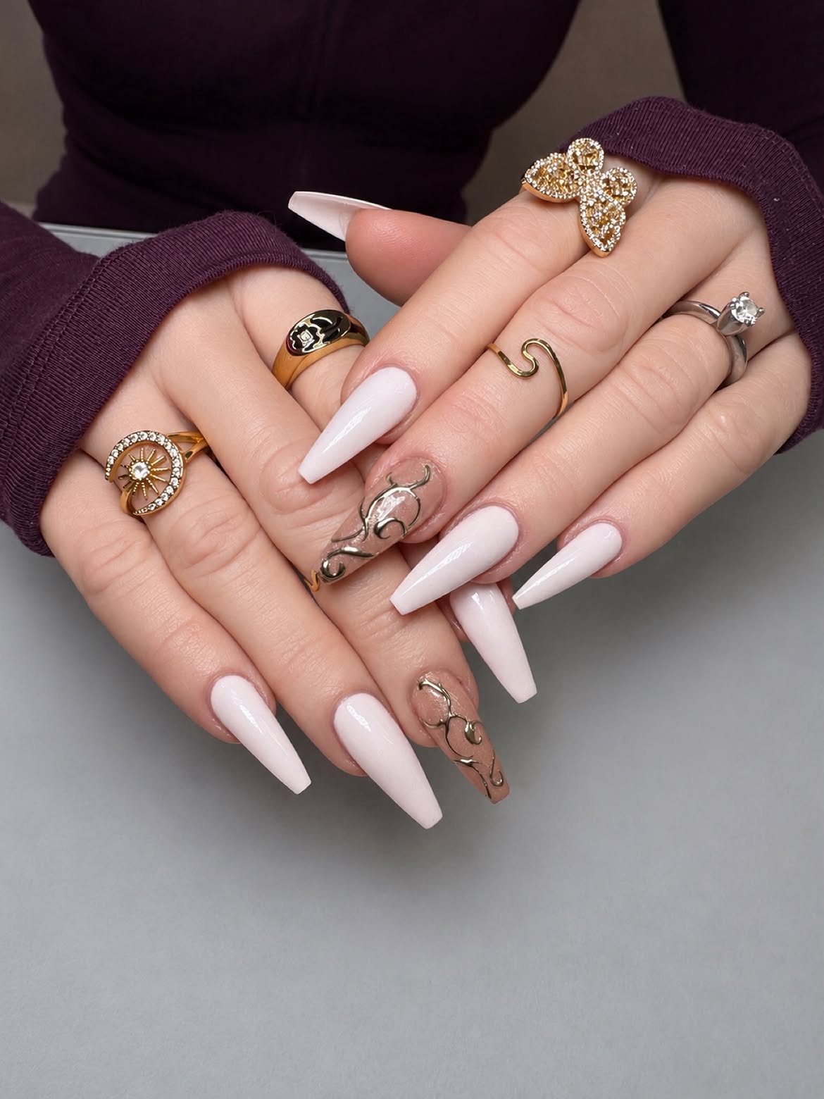 Creamy Milky Coffin Nails with Gold Swirl Art