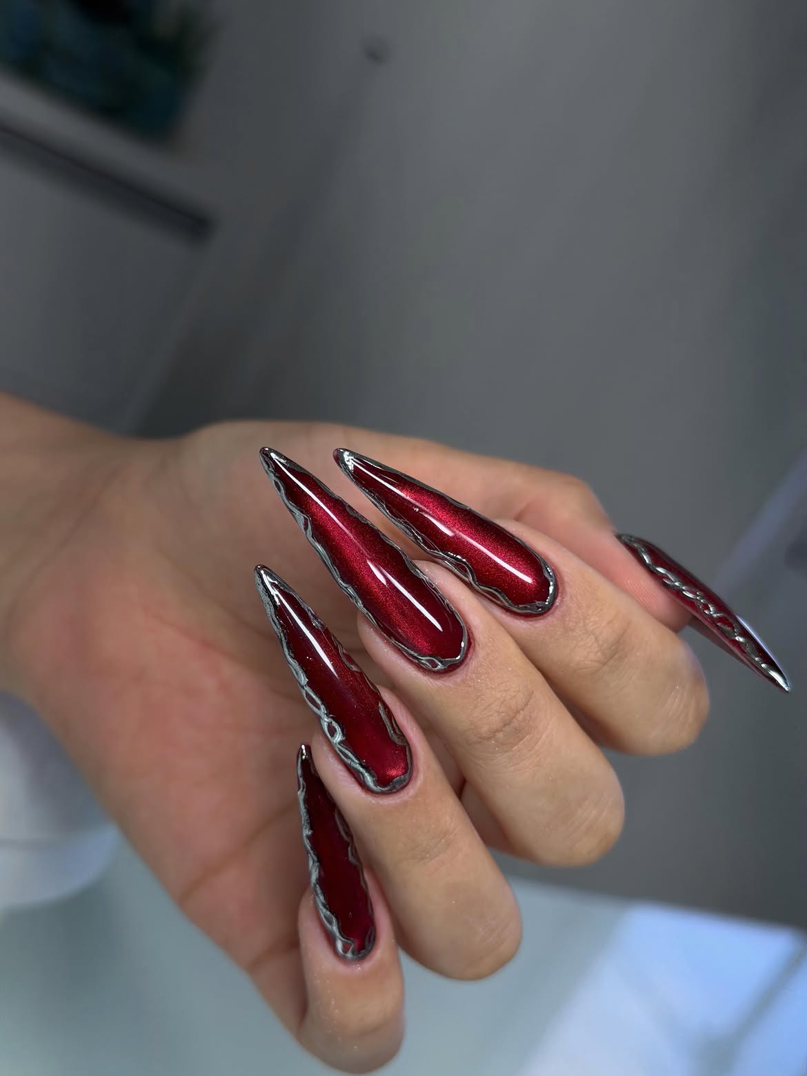 Crimson Chrome Stiletto Water Droplet Nails