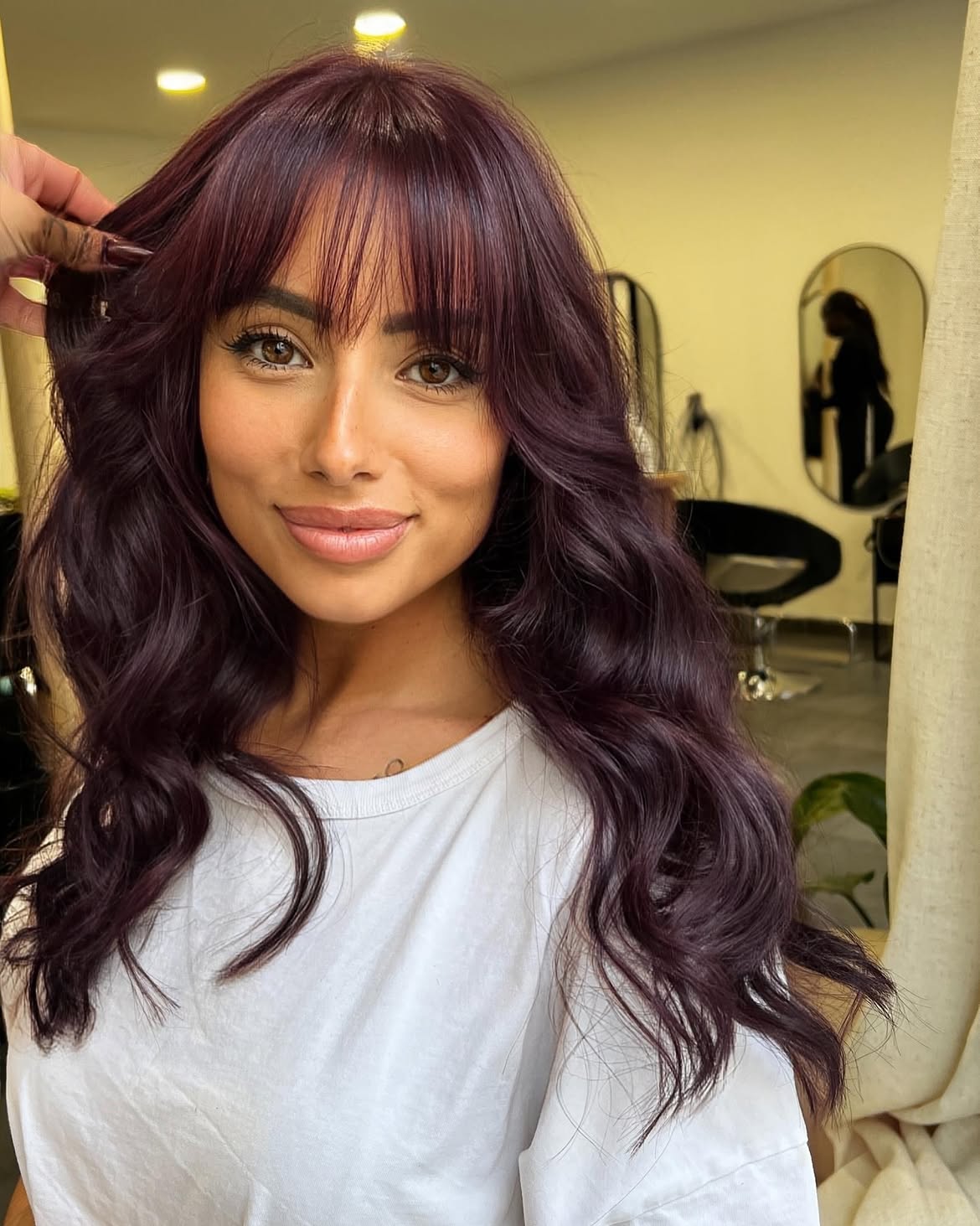 Deep Cherry Cola Balayage With Wispy Bangs