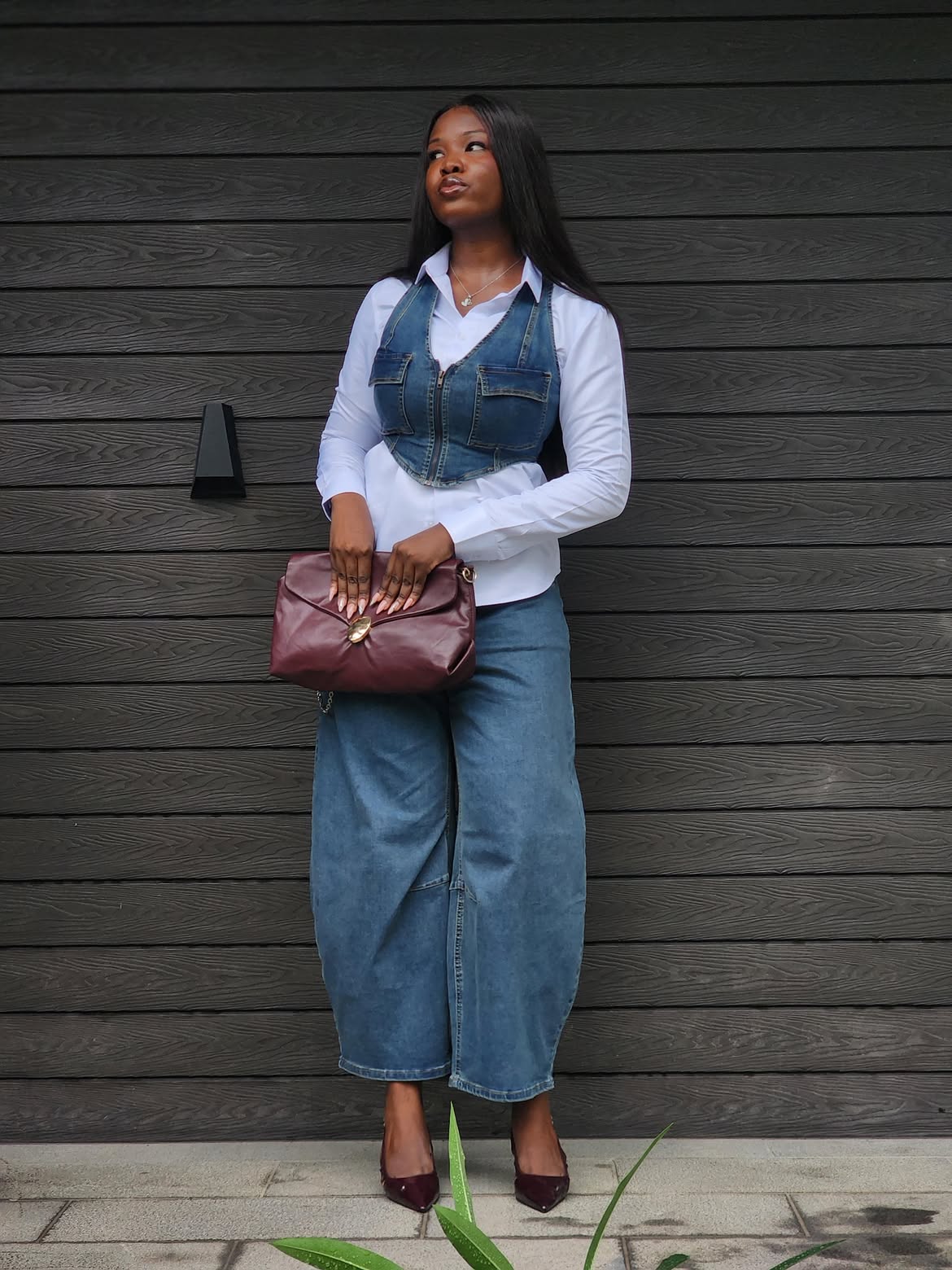 Denim Corset Vest Over White Shirt And Wide Leg Jeans
