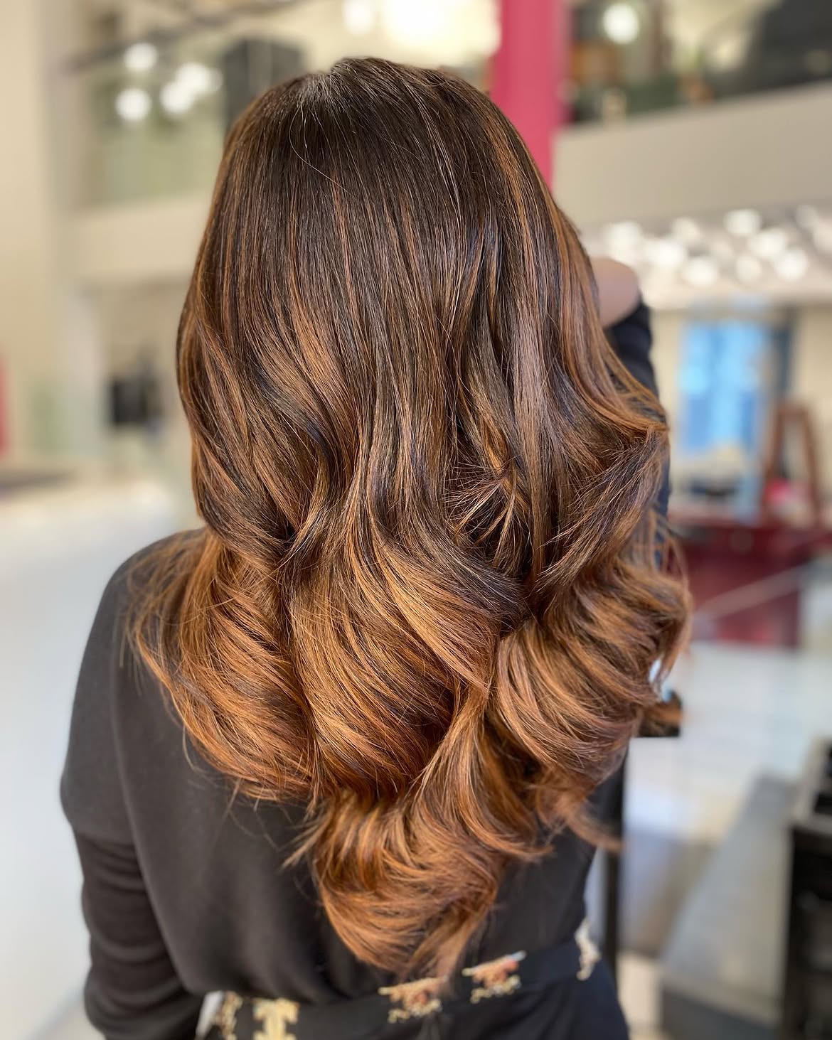 Dimensional Auburn Balayage On Dark Brown Waves