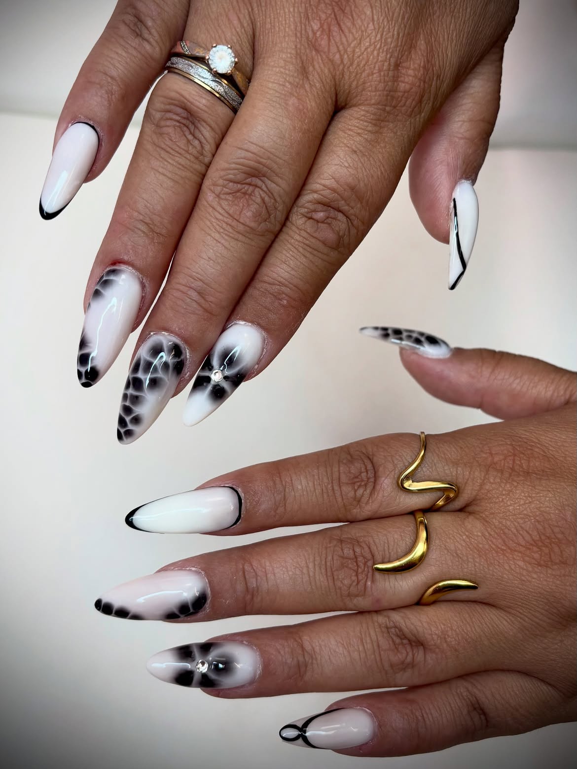 Dramatic Black and White Abstract Stiletto Nails