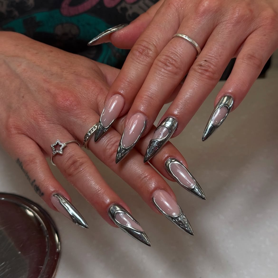 Edgy Metallic Chrome Heart Stiletto Nails