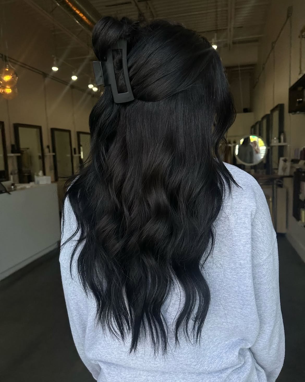Effortless Black Waves With Chic Half-Up Claw Clip