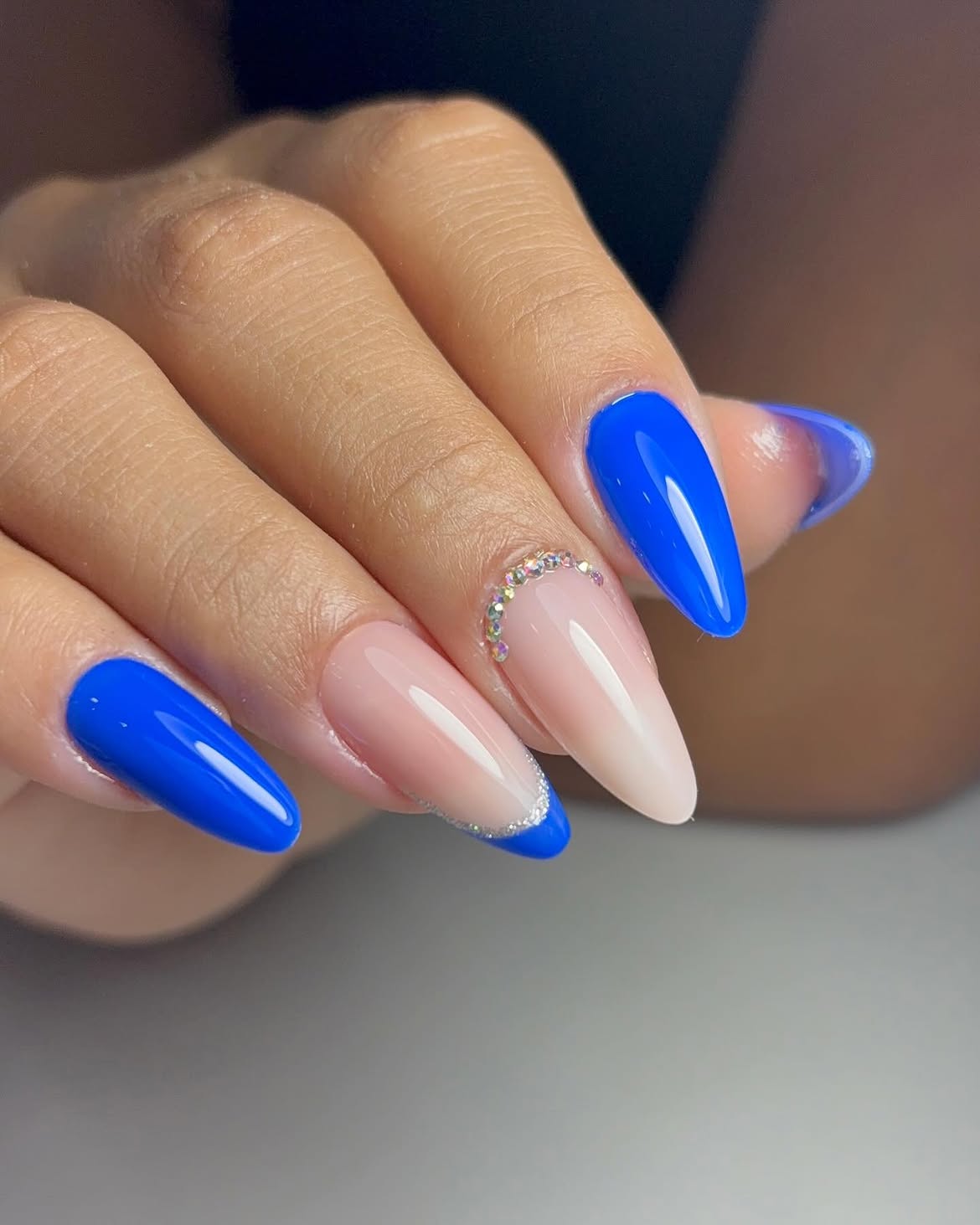 Electric Blue French Almond Nails with Rhinestone Accent