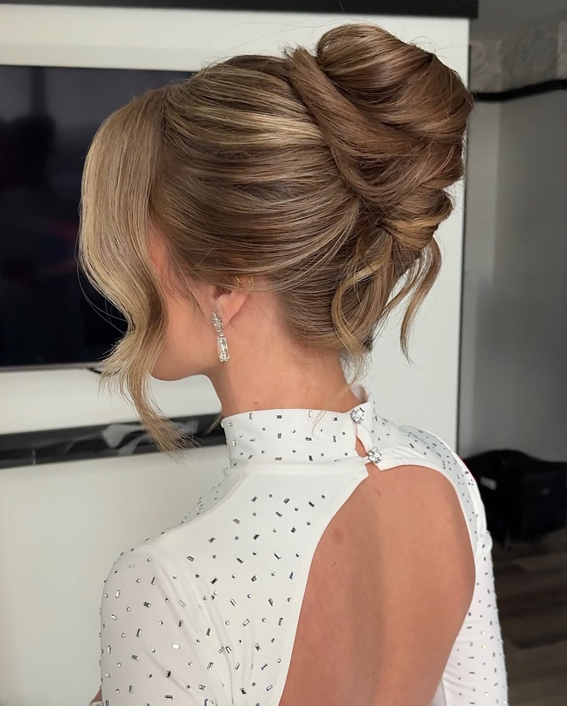 Elegant Chignon With Face Framing Tendrils
