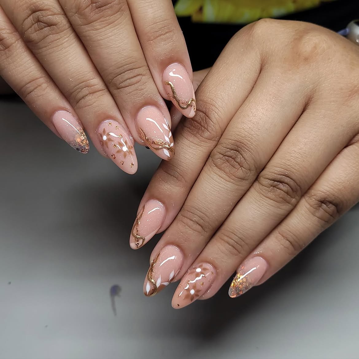 Elegant Gold Swirl and Dot Almond Nails