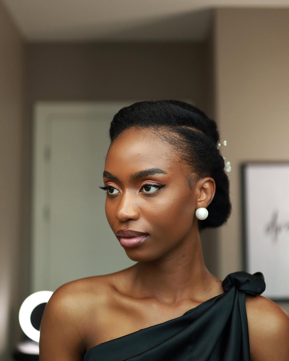 Elegant Sculpted Updo With Pearl Hair Accessories