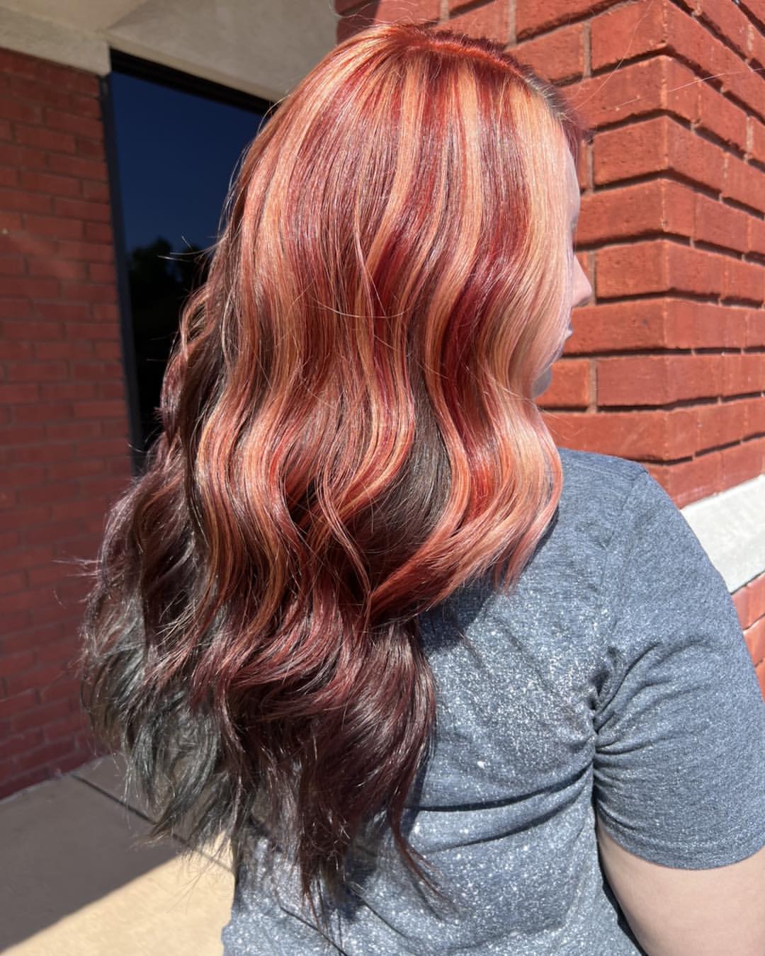 Fiery Auburn Peach Balayage With Dark Cherry Roots
