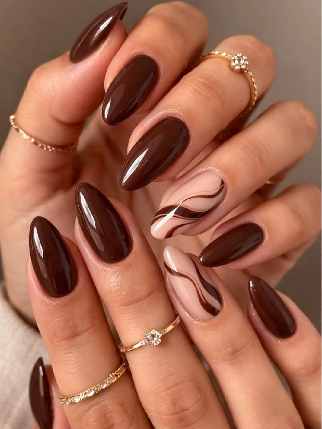 Glossy Dark Chocolate Swirl Almond Nails