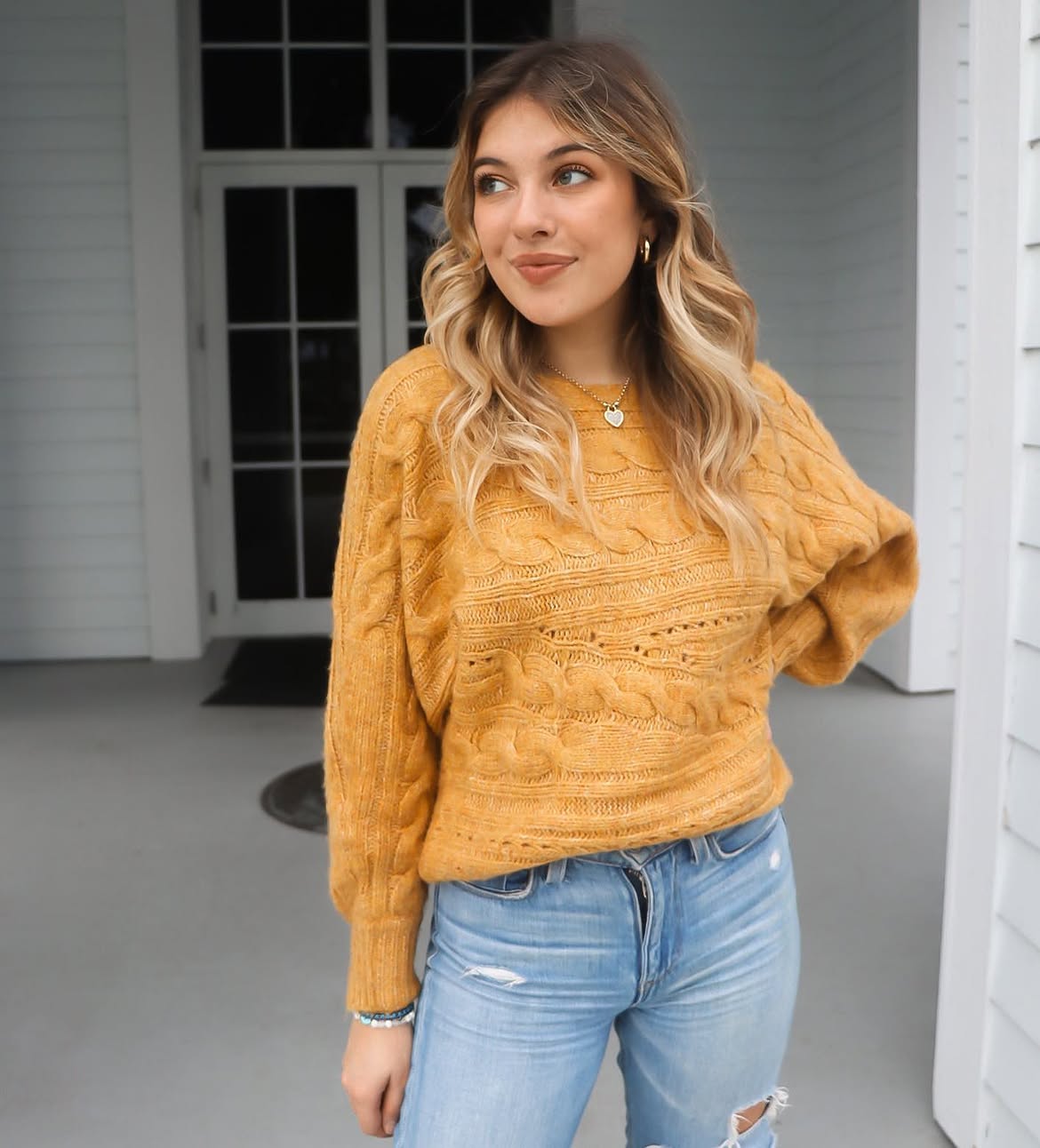 Golden Cable Knit Sweater With Light Wash Ripped Jeans