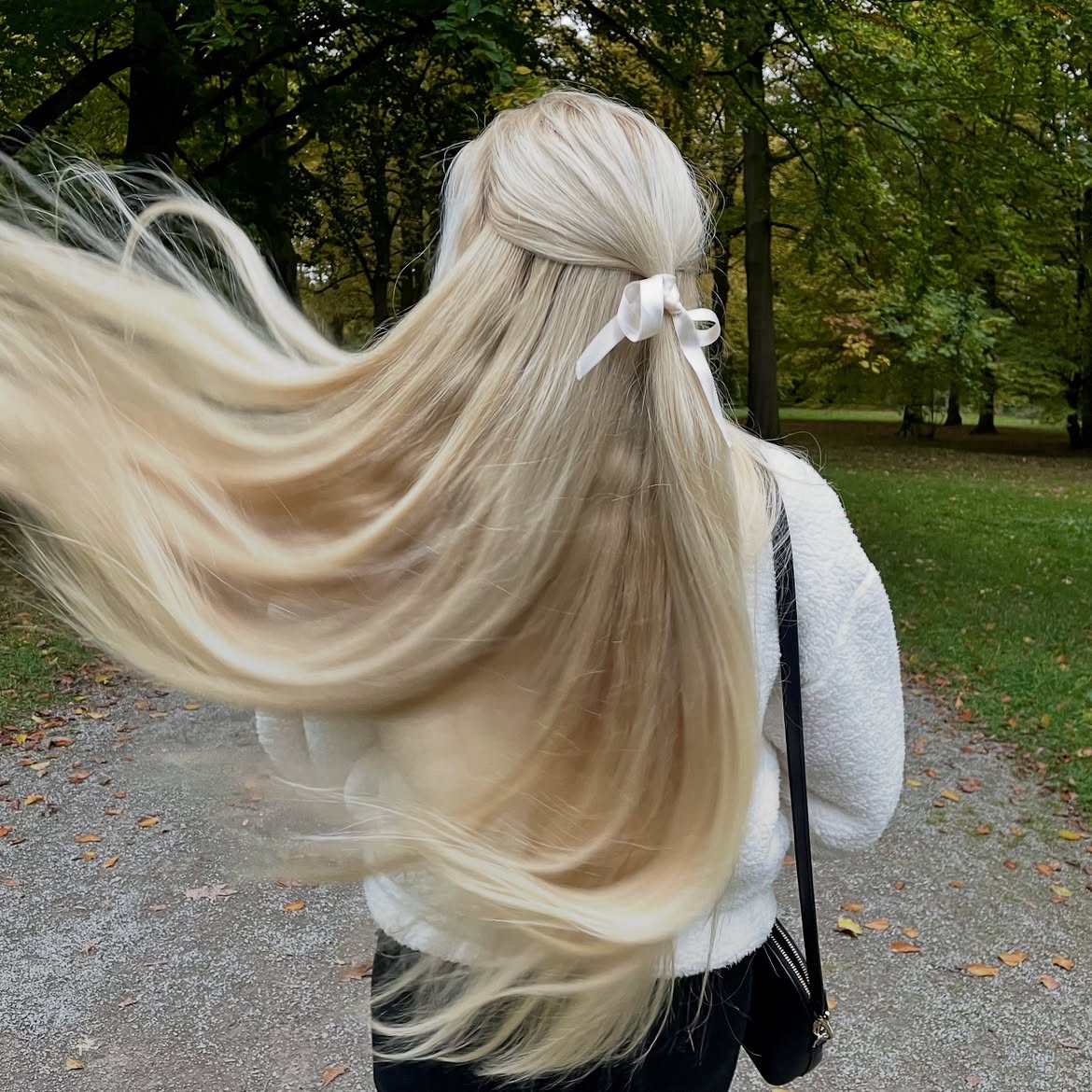 Half Up Bow Style With Flowy Blonde Waves