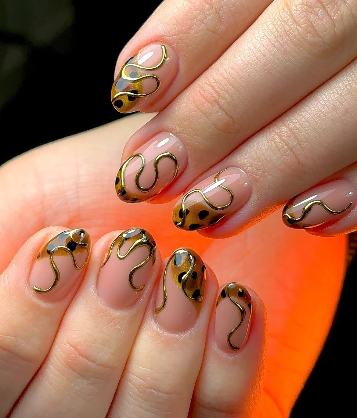 Leopard Drip Golden Swirl Oval Nails