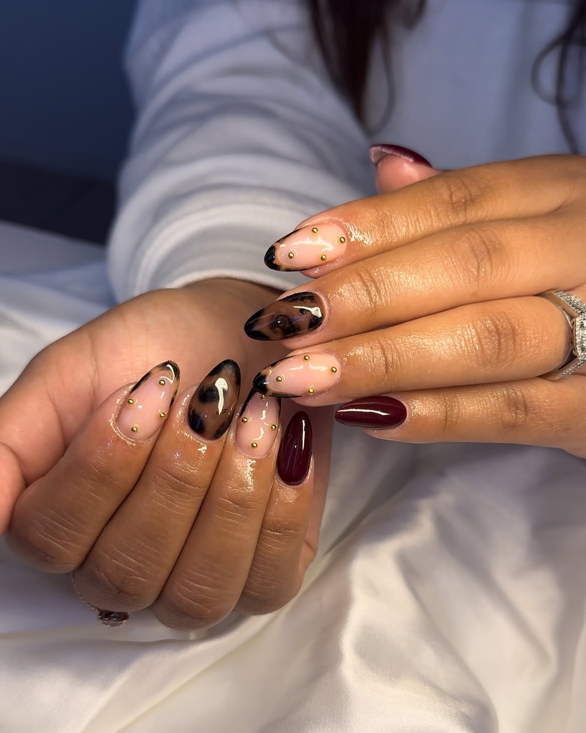 Leopard Print & Burgundy Almond Nails with Gold Studs