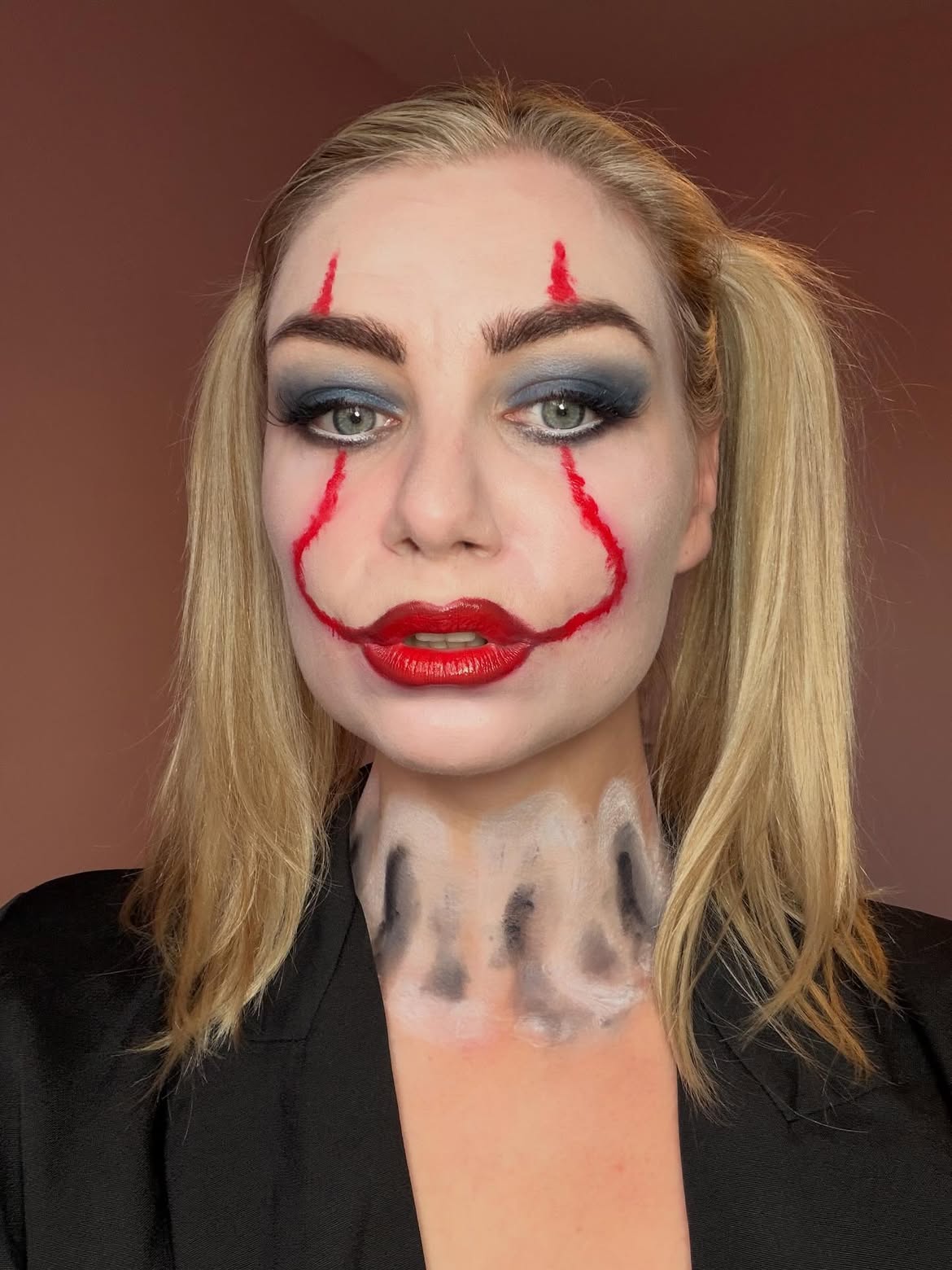 Mischievous Blonde Pigtails With Clown Makeup