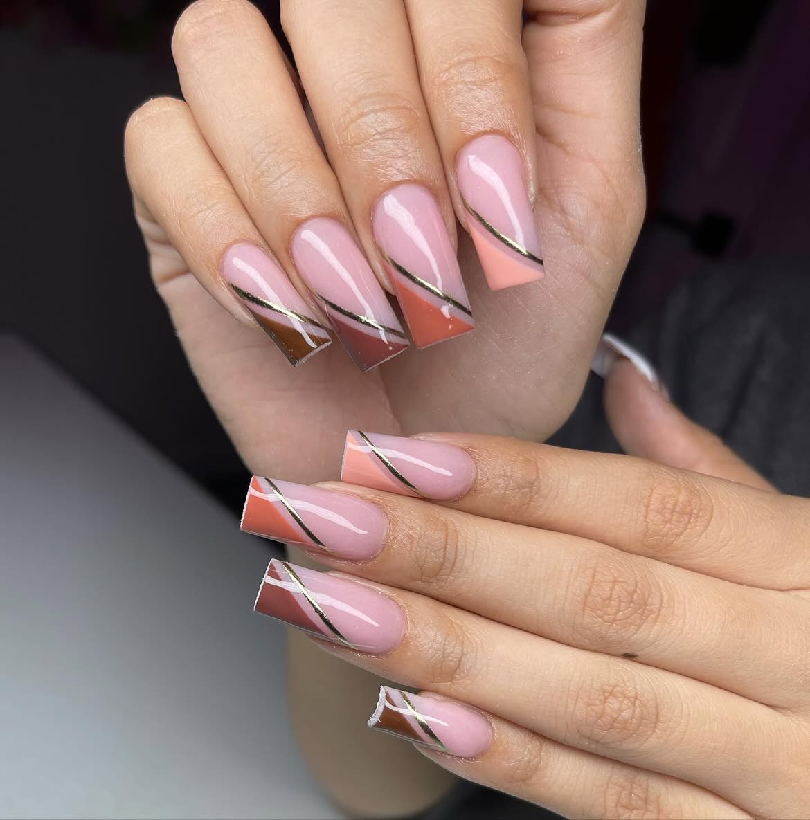 Pink French Tips With Geometric Cutouts and Gold Lines