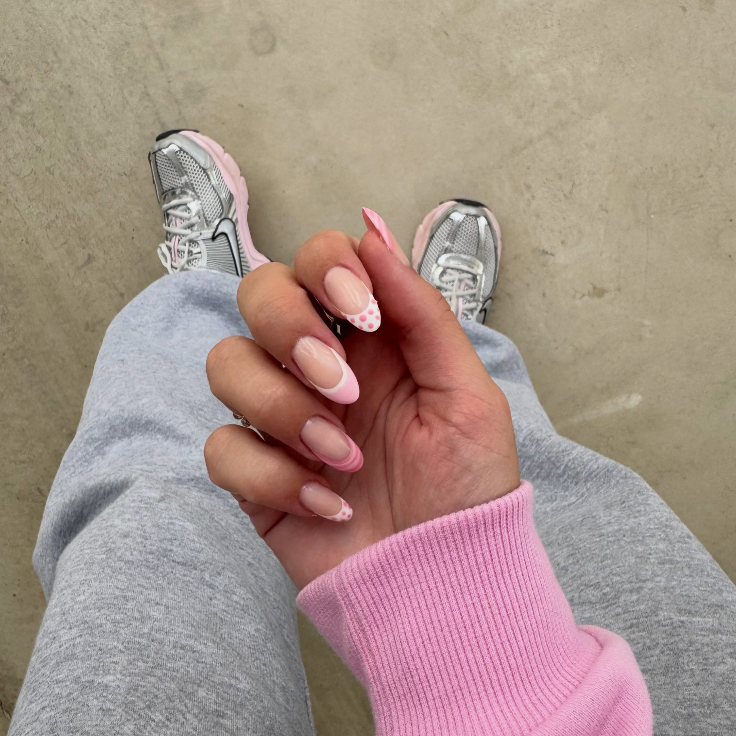 Playful Pink French Tip Almond Nails with Dots