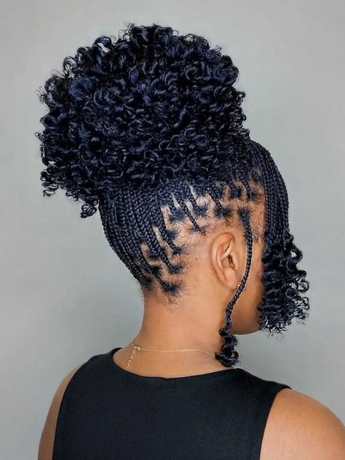 Protective Braids With Curly High Bun