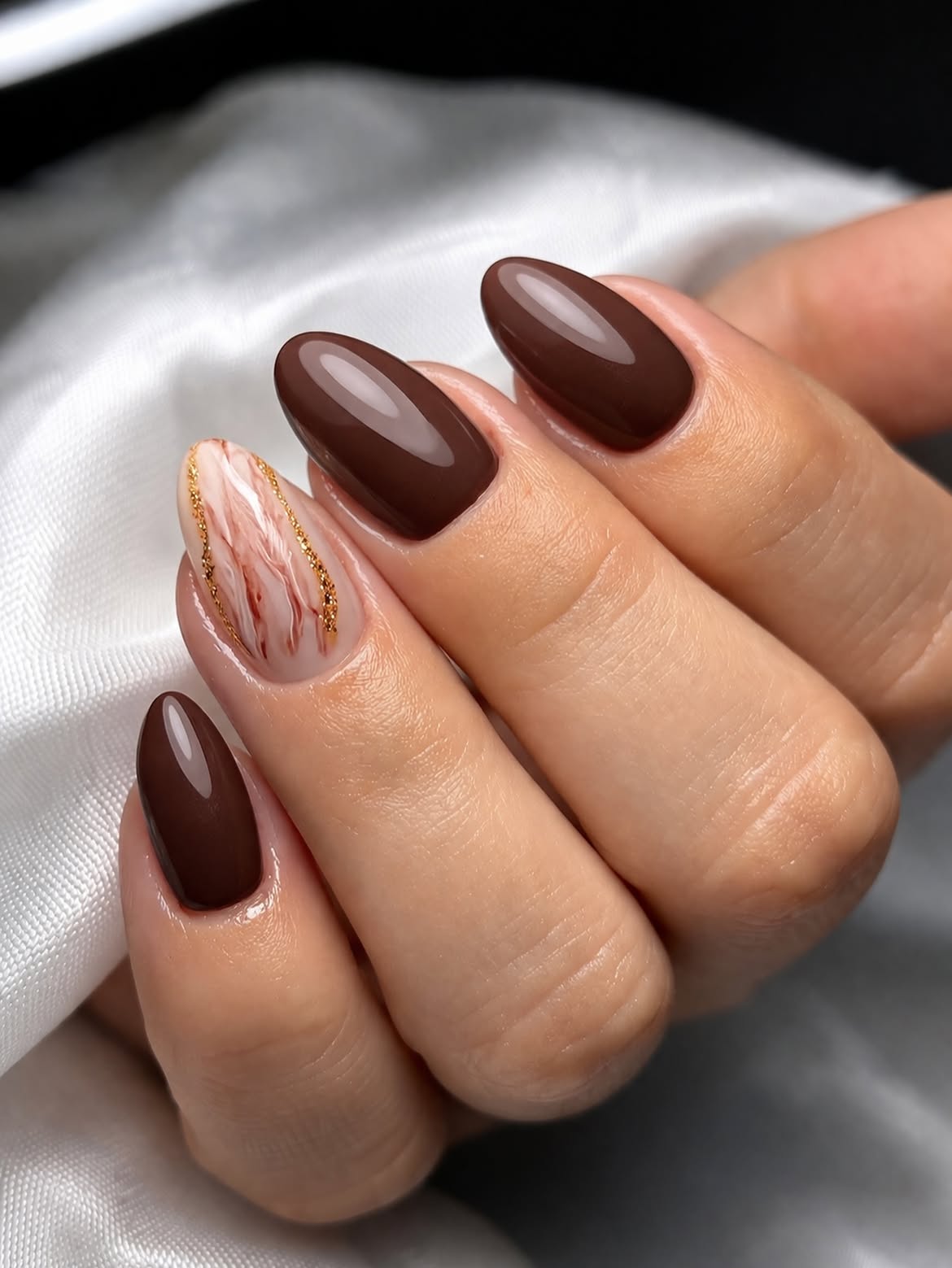 Rich Chocolate Swirl Almond Nails with Gold Detail