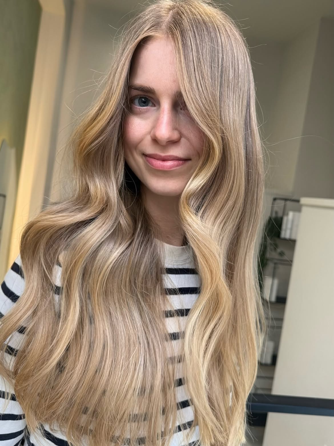 Sandy Blonde Waves With Face-Framing Layers