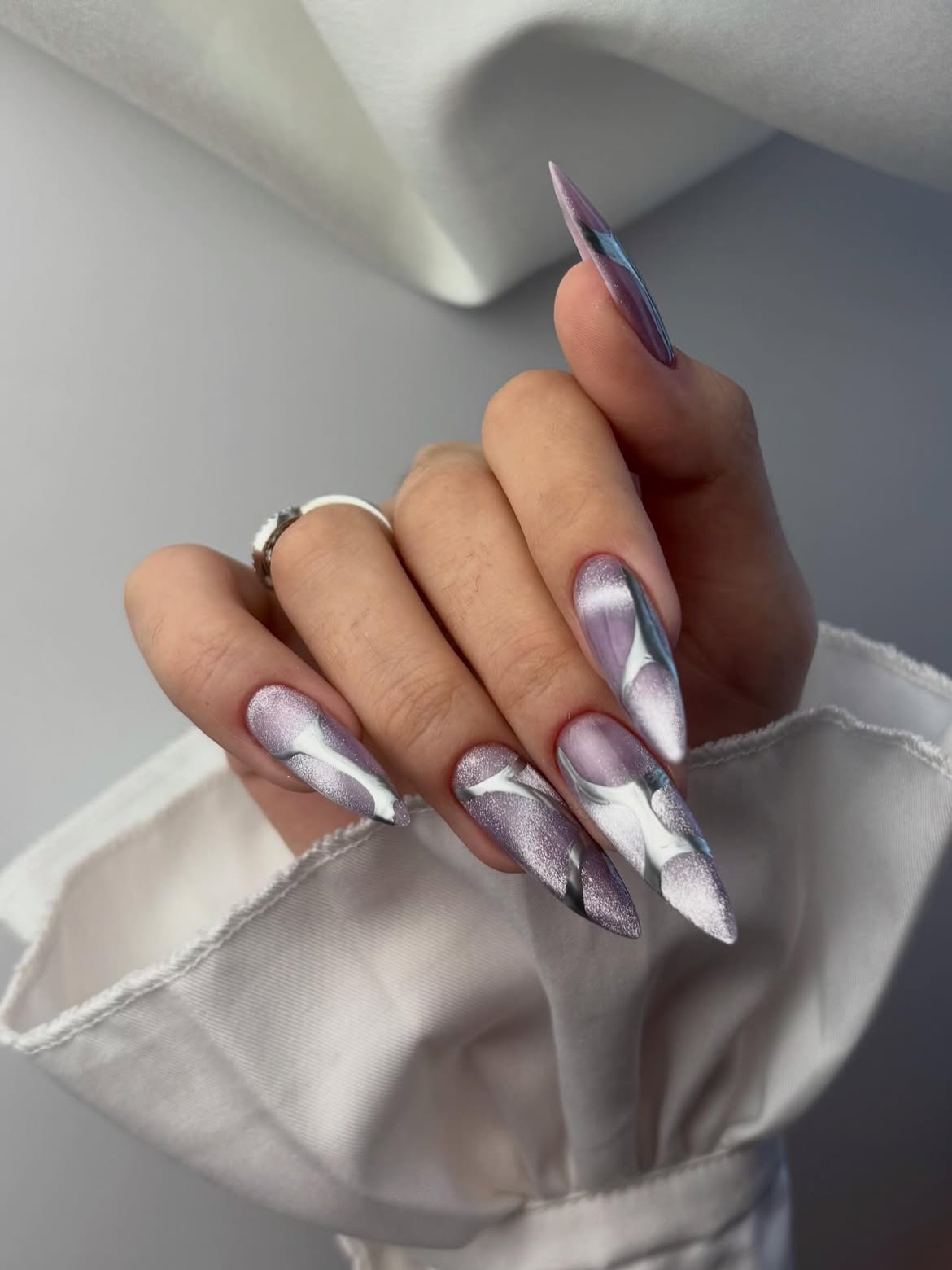 Shimmering Lavender Marble Stiletto Nails