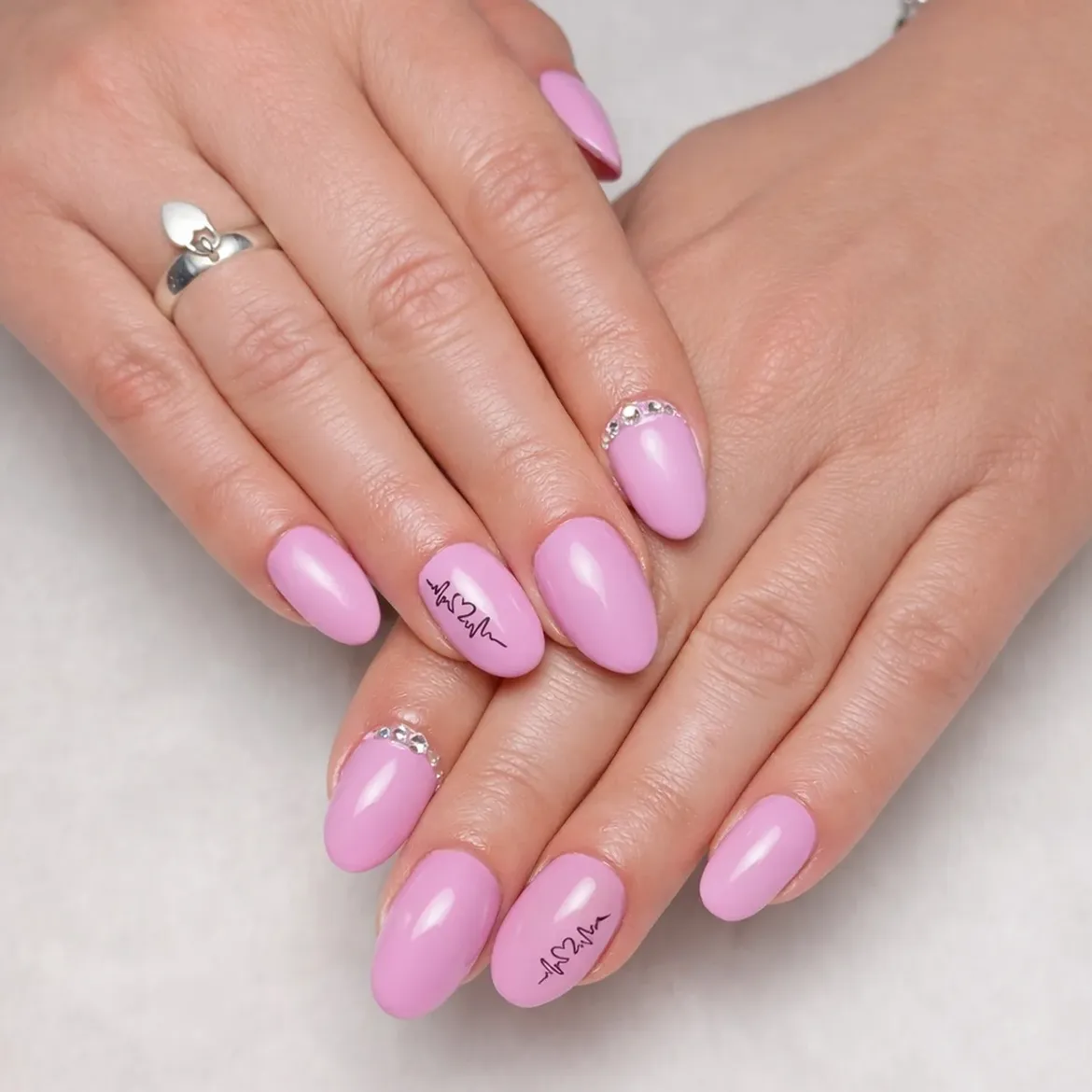 Soft Pink Oval Nails with Heartbeat Art