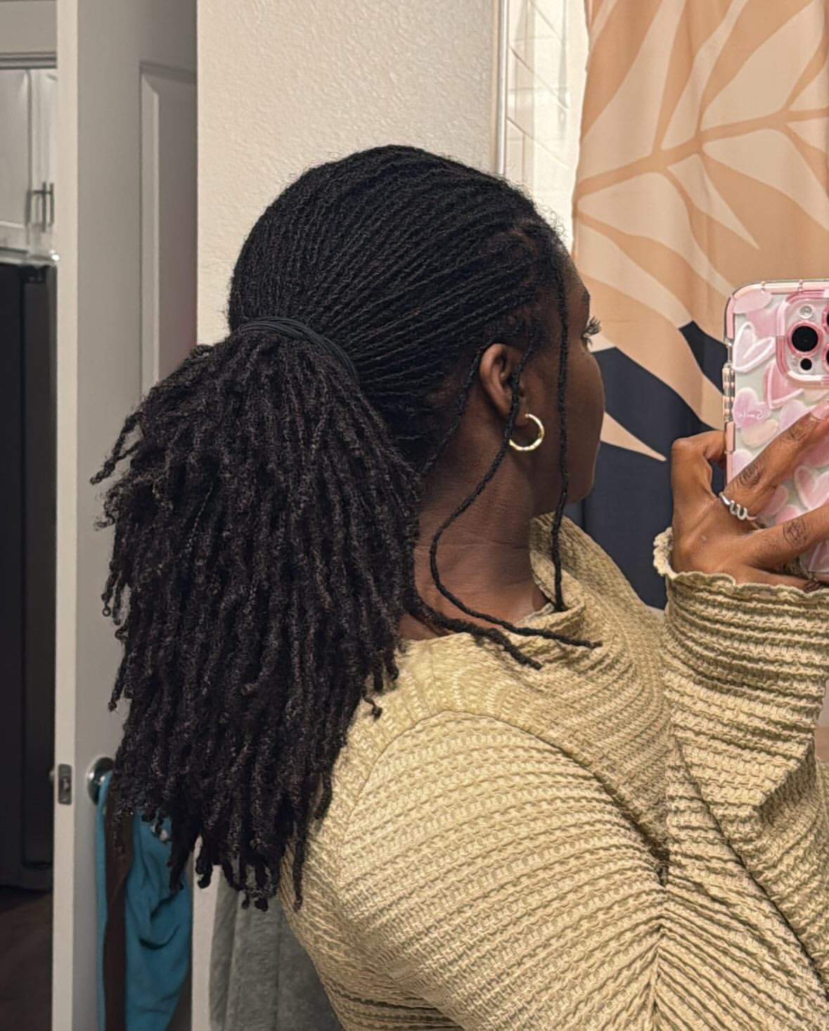 Textured Locs Pulled Into A High Ponytail