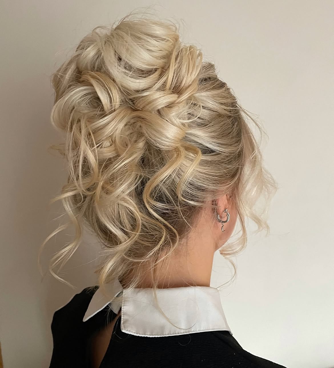 Tousled Blonde Updo With Loose Curls