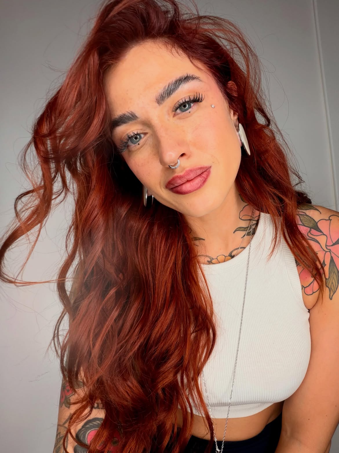 Vibrant Copper Red Waves With Face-Framing Layers
