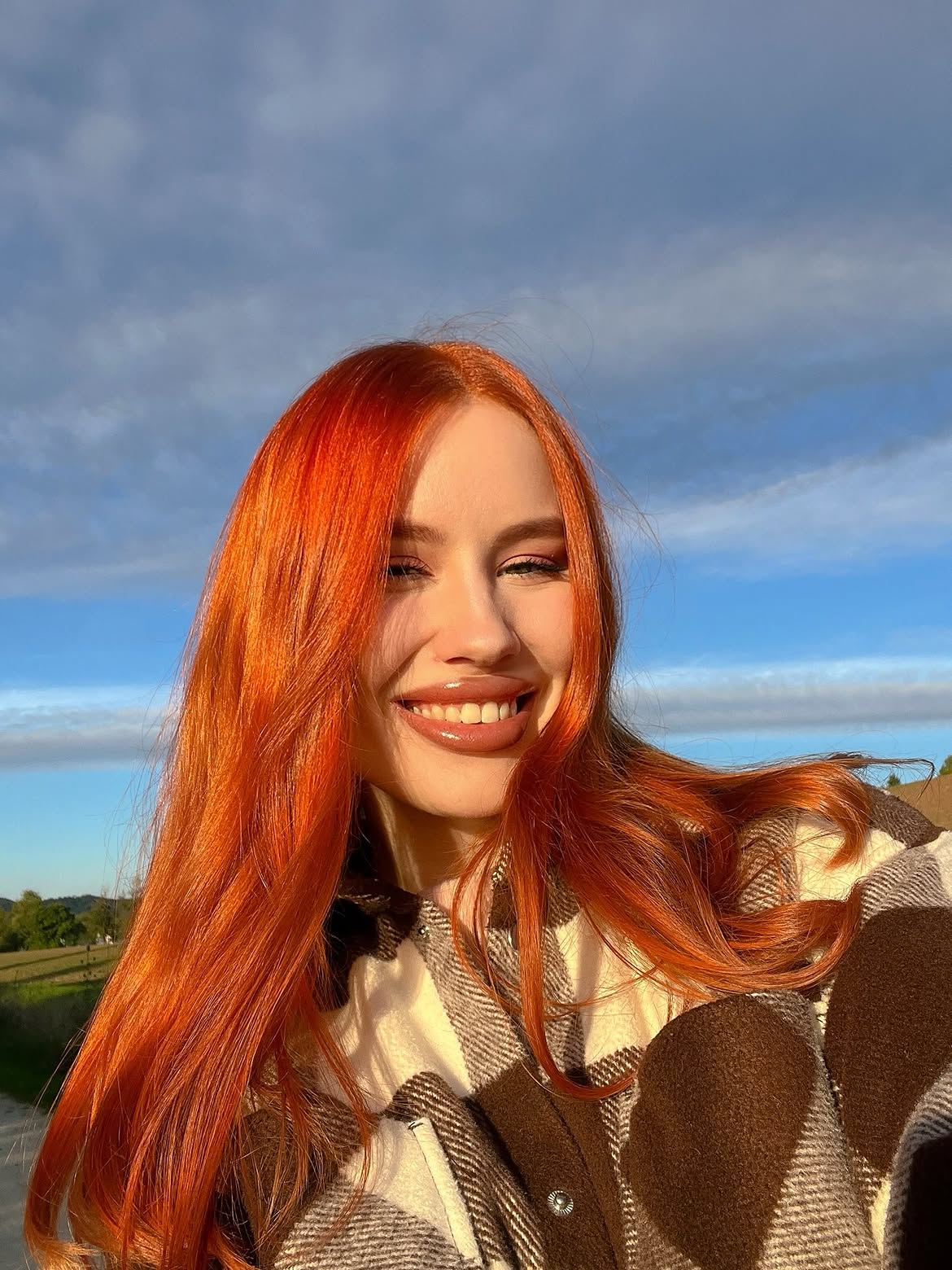 Vibrant Fiery Orange With Face-Framing Layers
