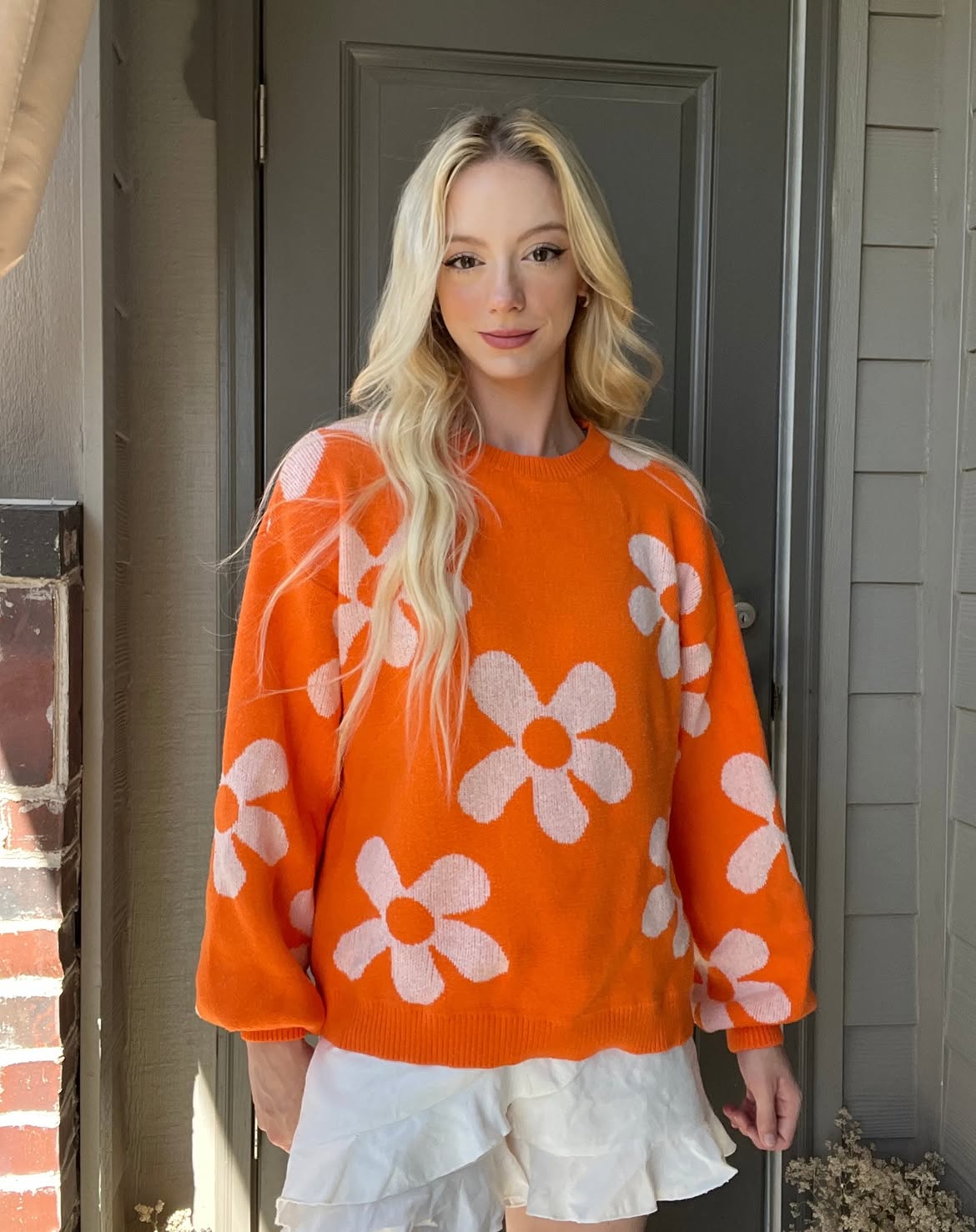 Vibrant Floral Orange Knit With Ruffled White Skort