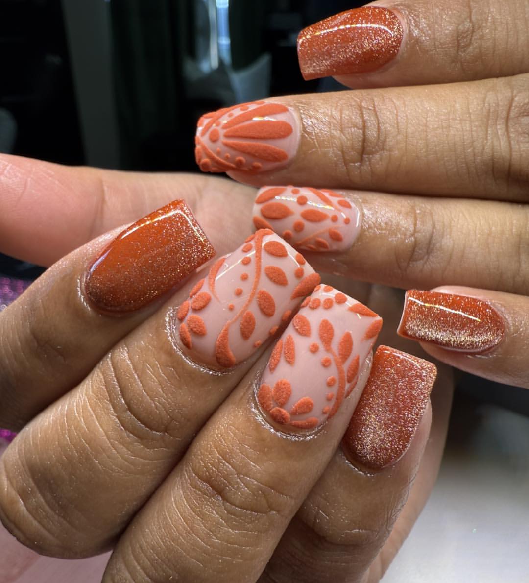 Vibrant Orange Glitter & Embossed Floral Nails