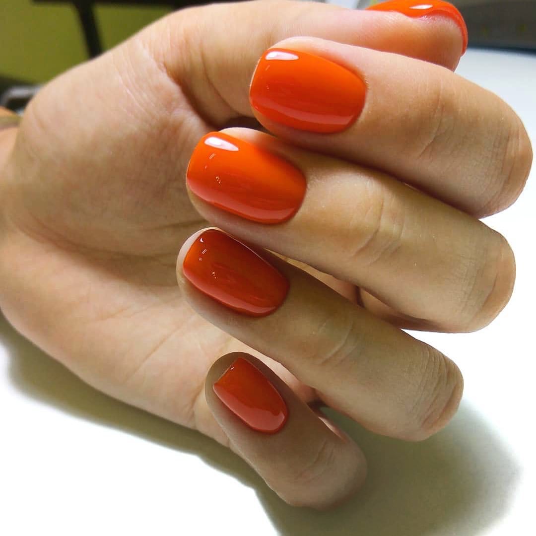 Vibrant Orange Glossy Oval Nails