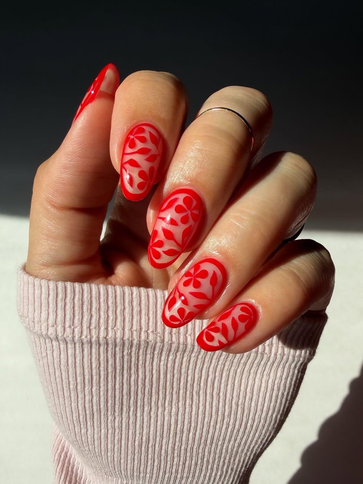 Vibrant Red Floral Cut-Out Almond Nails