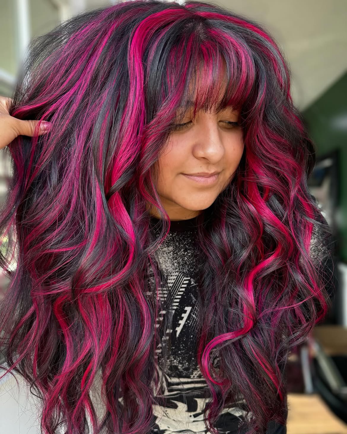 Vivid Magenta Streaks On Dark Wavy Hair