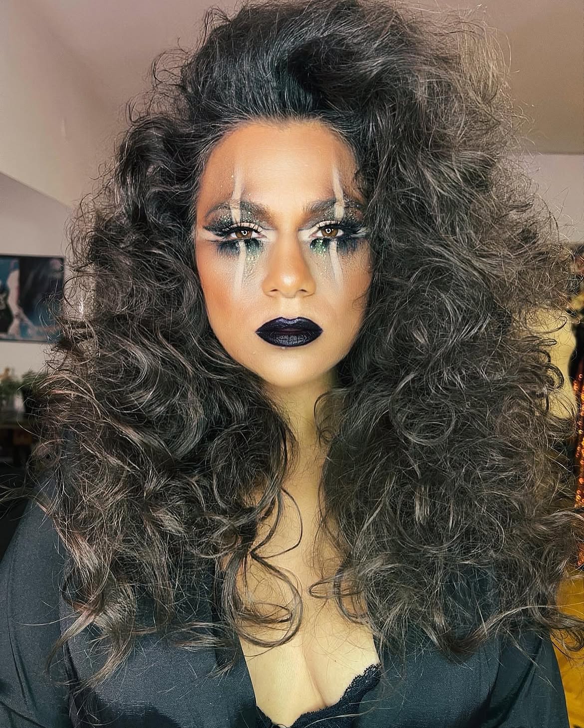 Voluminous Dark Curls With Wispy Bangs