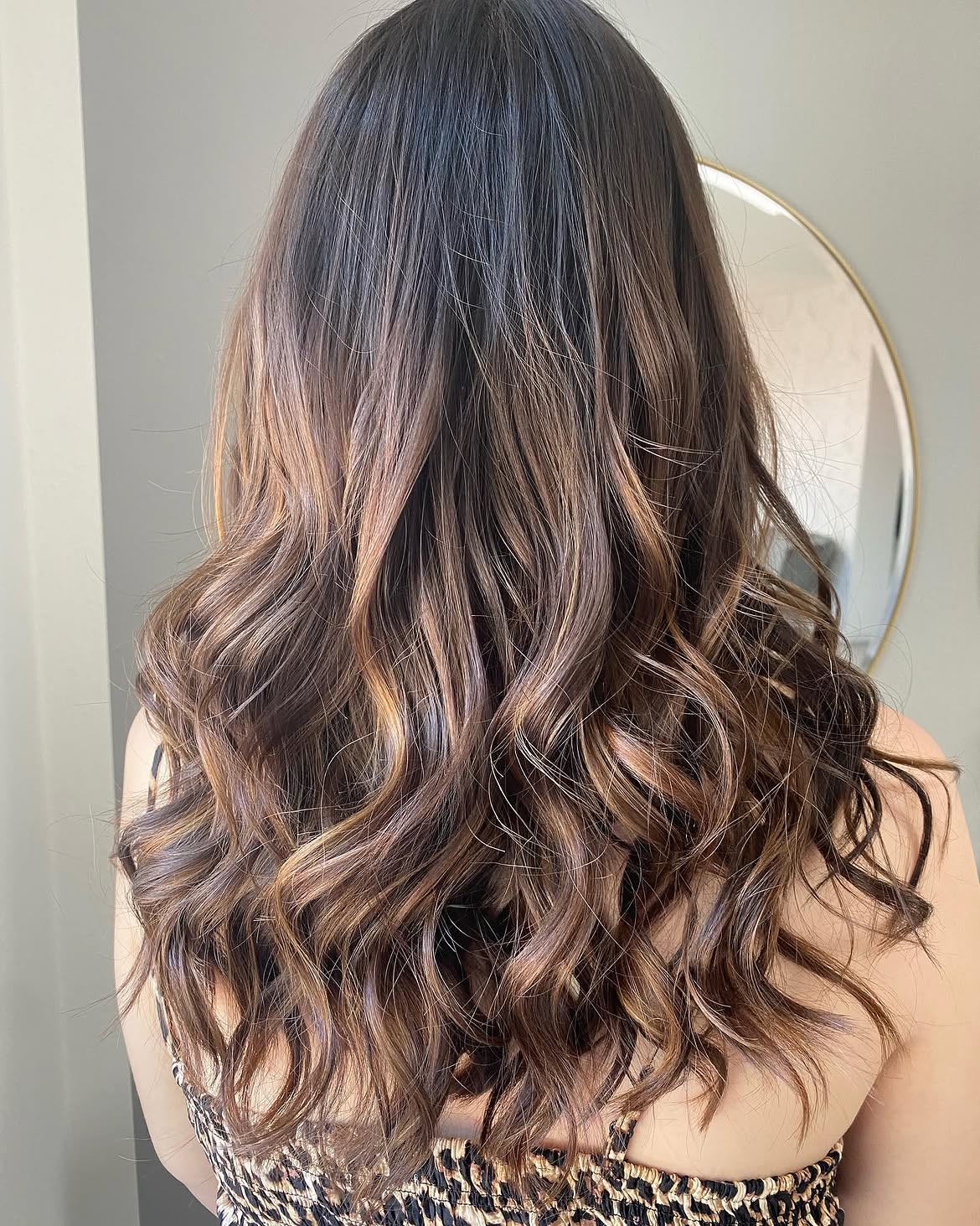 Warm Balayage Highlights On Long Wavy Hair