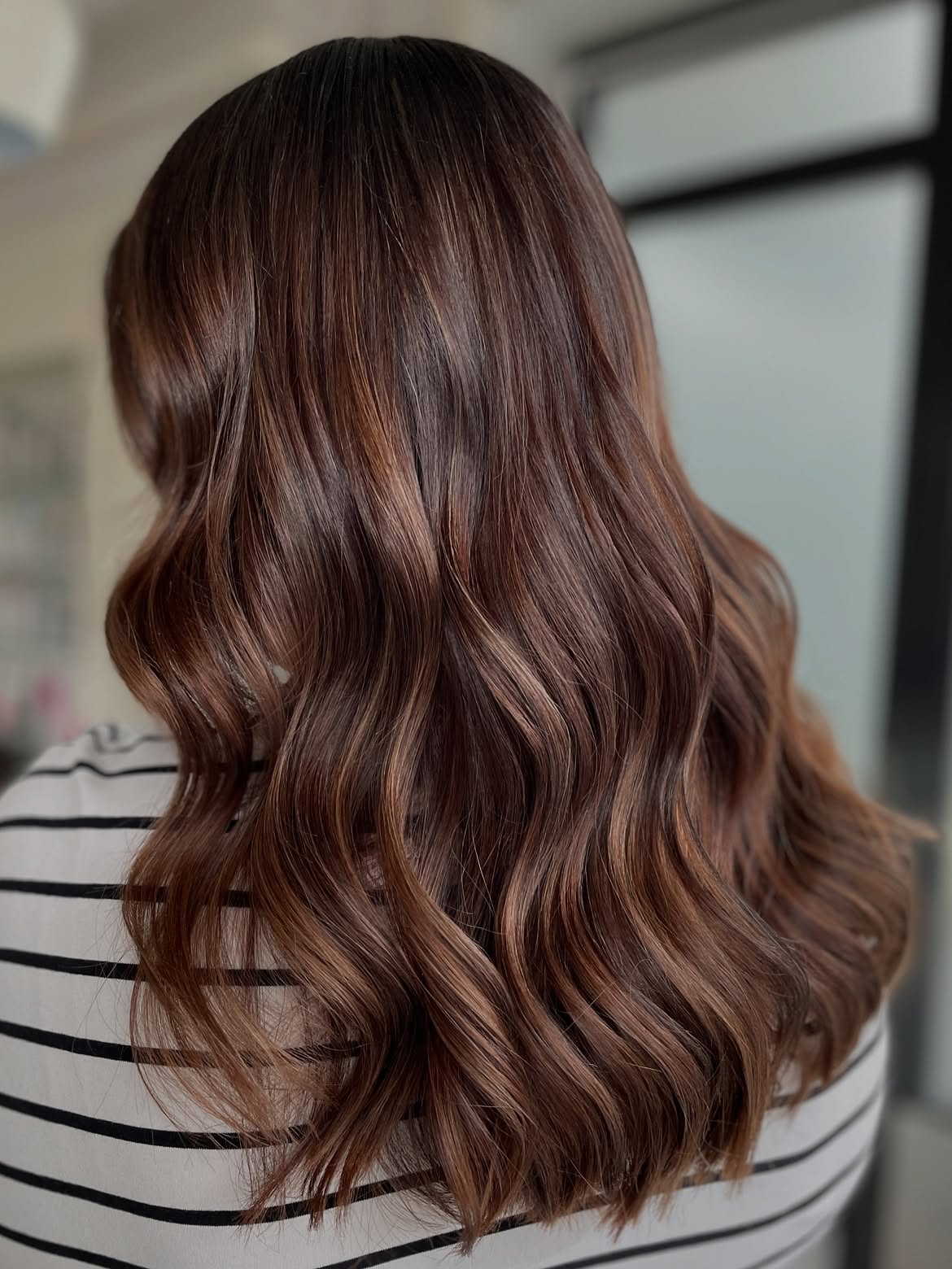 Warm Bronde Balayage With Soft Waves