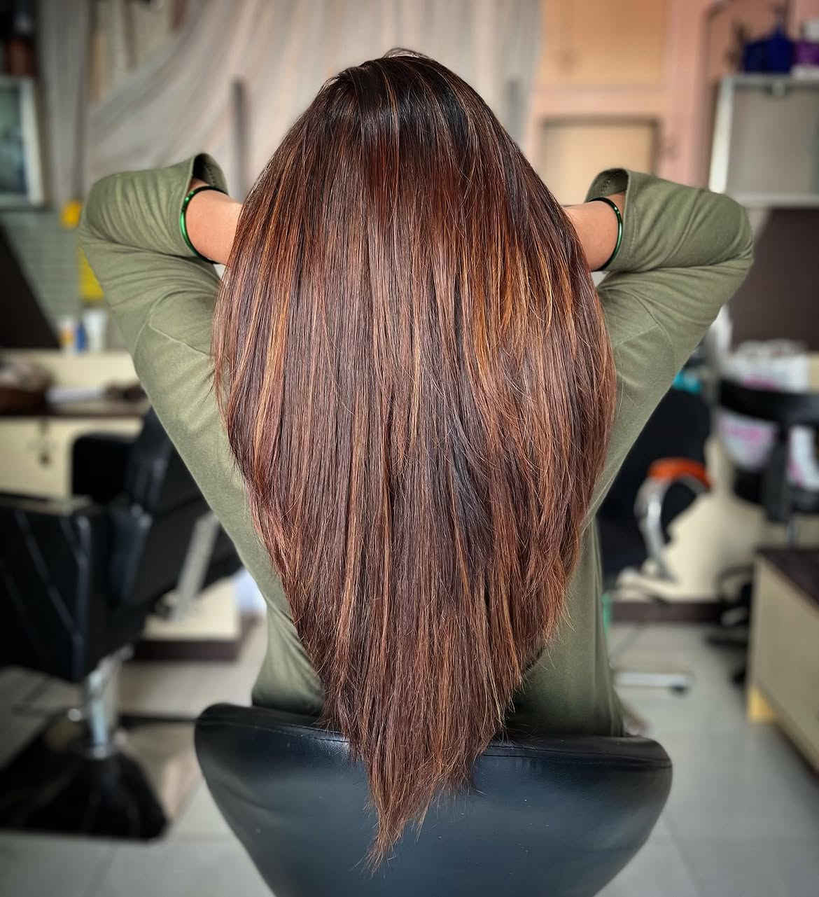 Warm Cinnamon Highlights On Long Layered Hair